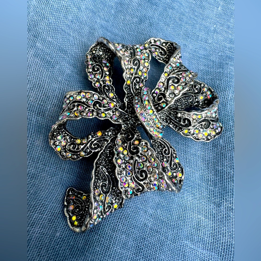 Silver brooch with sparkling stones